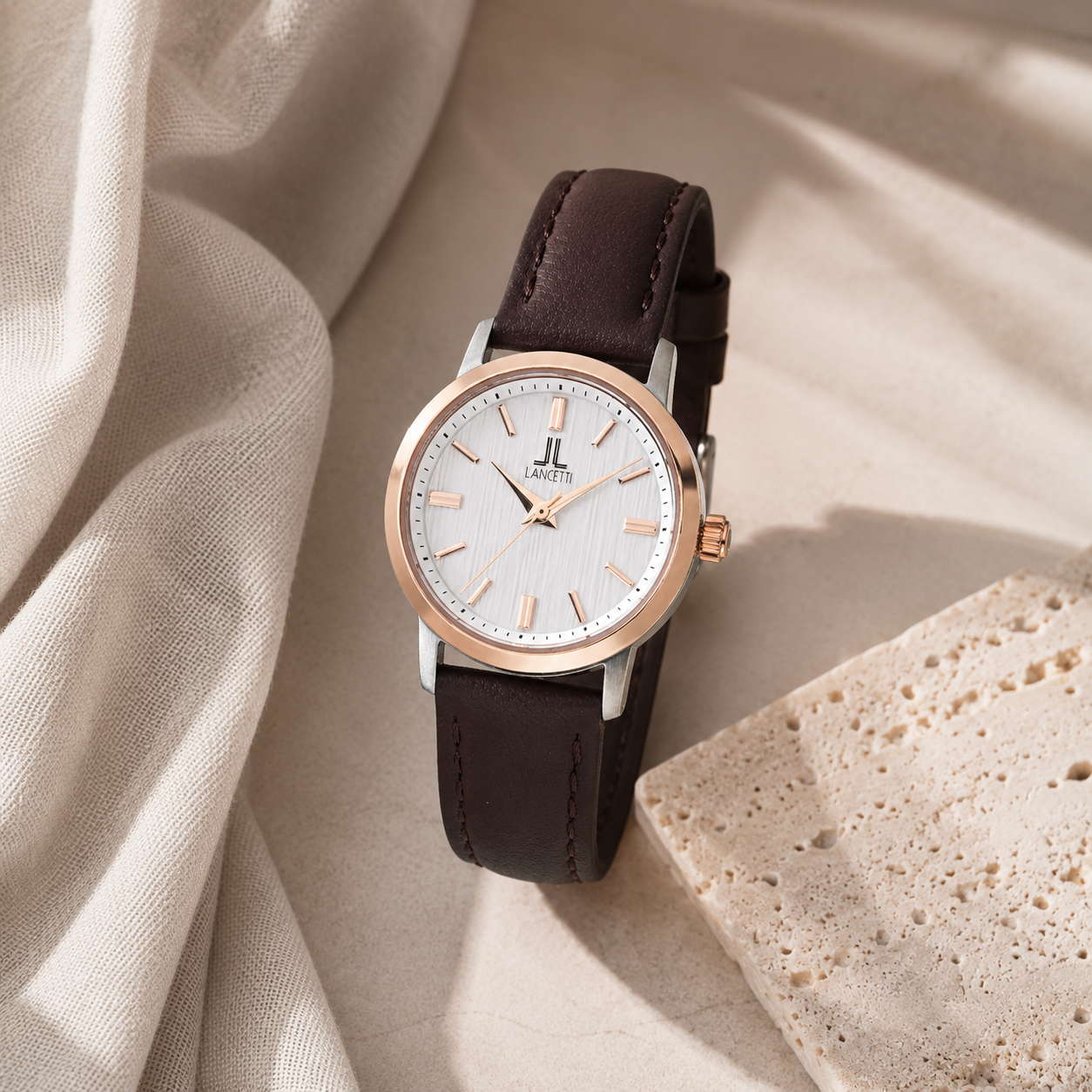 LANCETTI watches arranged in soft window light.